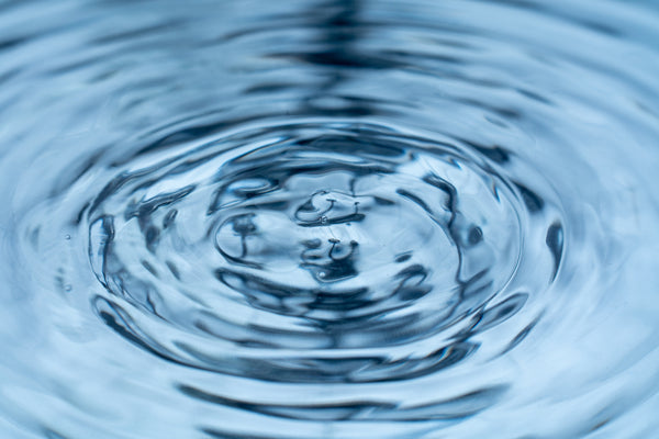 Drop of water symbolizing the ripple effect of kindness.