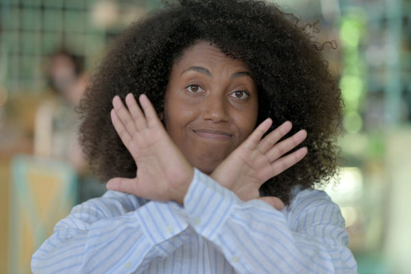 Woman signalling no.