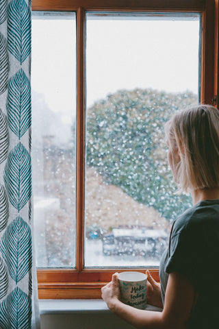 Woman staring out the window 