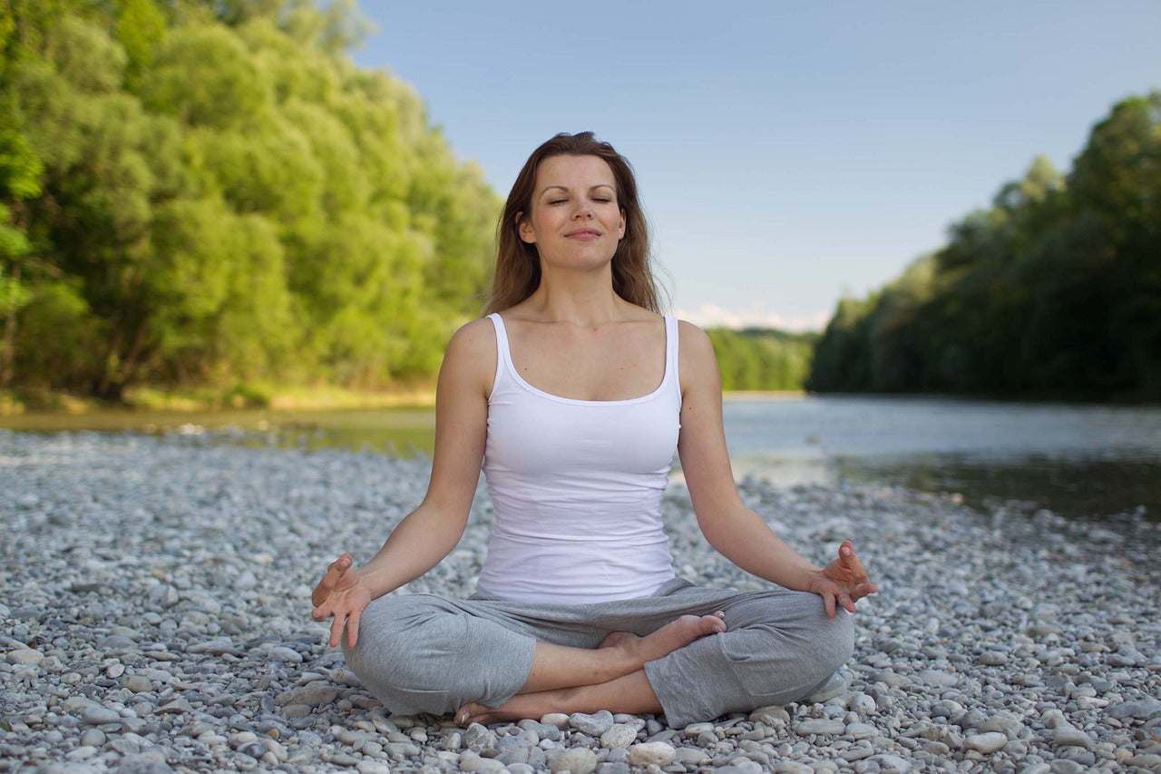 Person meditating or doing yoga