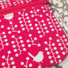 Pink zipper pouch with little birds and fire sparks creations label