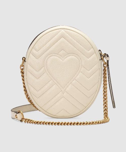 white round gucci purse