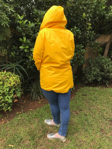 yellow raincoat silver lining gumboots back view