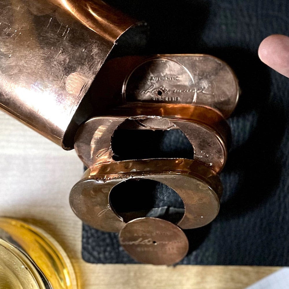 Picture of Jacob Bromwell flasks with the circle dial being cut out of the bottom