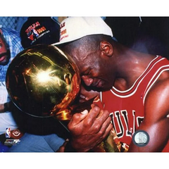 MIchael Jordan holding championship trophy