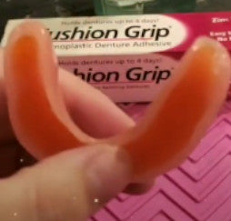 applied cushion grip to lower dentures