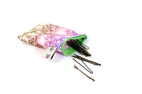 mini sized wet bag from berry bug shop is holding bobby pins