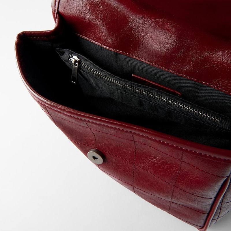 red leather messenger bag