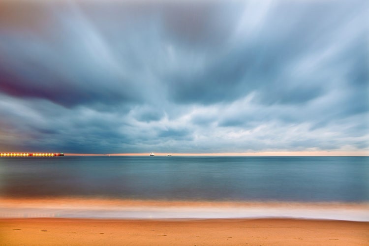 The beach view at sunset captured with Long Exposure by the help of a ND filter