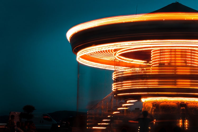 Acolorful merry go round captured in long exposure using a ND filter