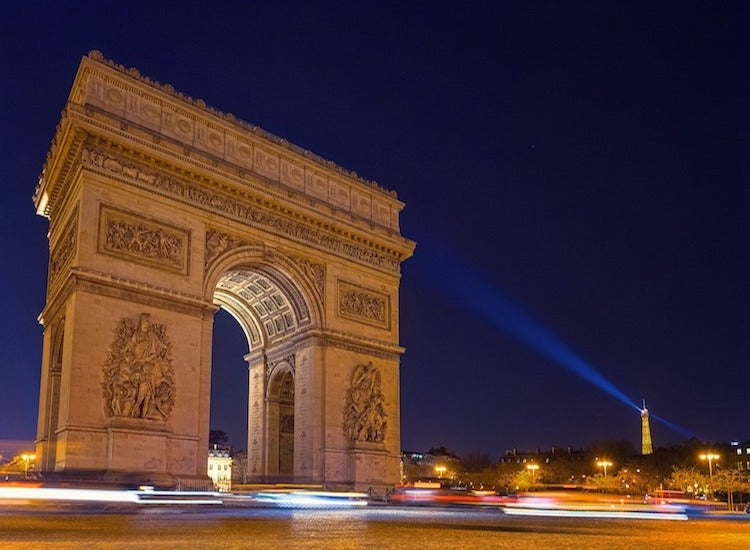 cars passing by arc de triumph at Paris