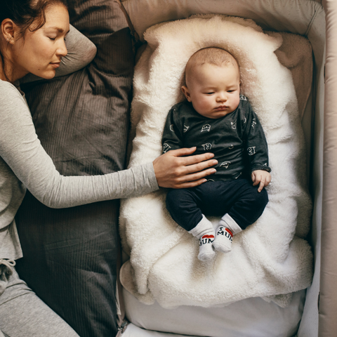 Baby sleeping with mom