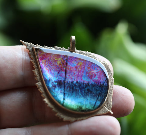 bronze pendant featuring 'icy pond' image