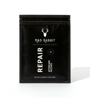 Black packaging of Mad Rabbit tattoo aftercare patches labeled 'REPAIR.'