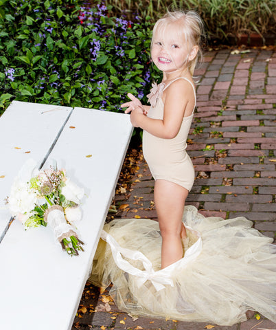 ic: This flower girl gets comfy post-ceremony. Tulle can be itchy!