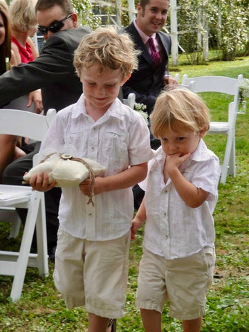 ic: Ring bearer (right) decided at the last minute he strongly disliked his chosen foot wear. Fortunately his grandmother (not part of the ceremony) was tasked to help the kids, and she had an extra pair of his favorite shoes ready to go.