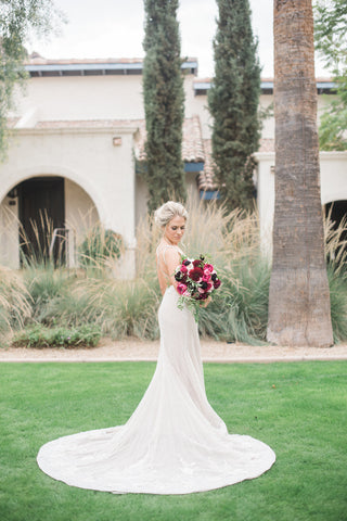 Perfect positioning of this bride's skirt makes sure every gorgeous detail is seen.