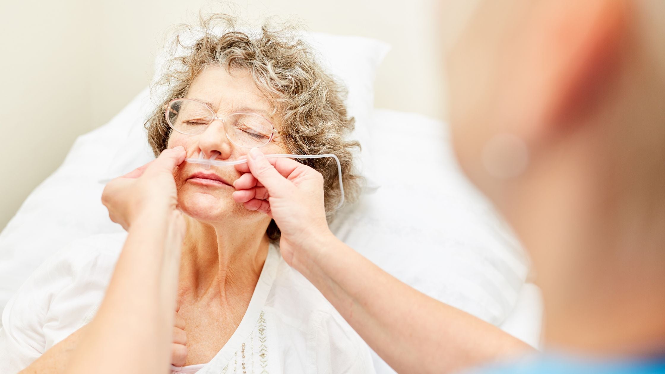 elderly man with covid talking to a doctor