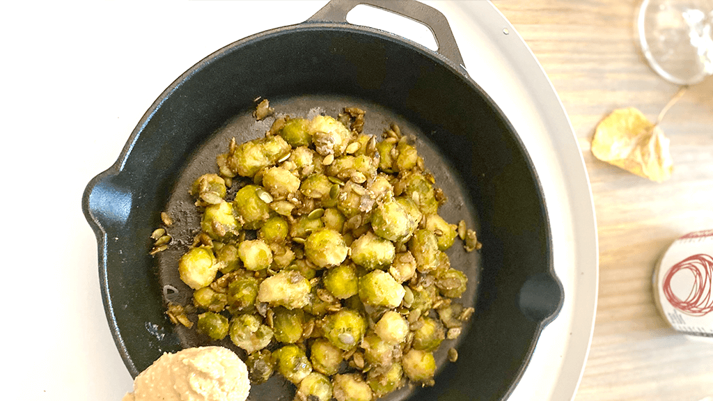 Best roasted brussel sprouts recipe with maple peanut butter sauce and roasted pumpkin seeds