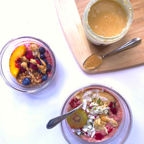 Smoothie bowls drizzled with natural peanut butter.