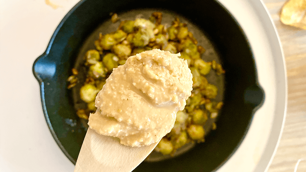 Oven baked brussel sprouts with natural peanut butter sauce and roasted pumpkin seeds recipe