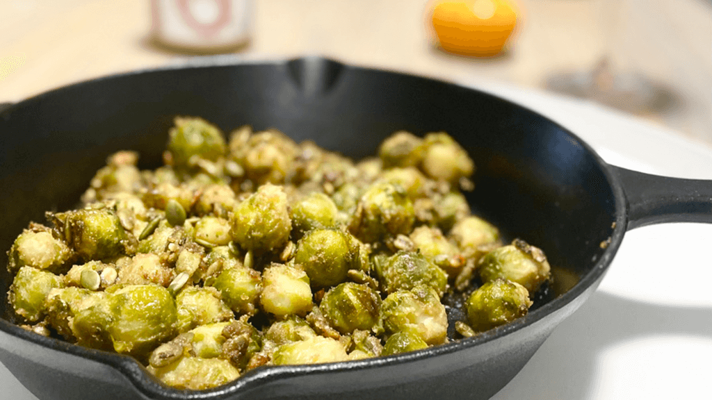 Roasted pumpkin seeds on pan fried brussel sprouts with maple peanut butter sauce recipe