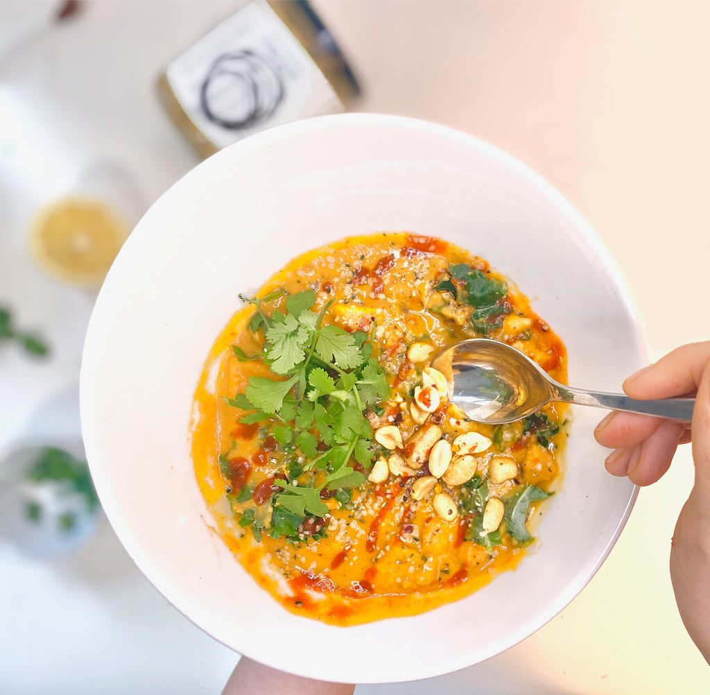 Natural peanut butter, sweet potato stew topped with roasted peanuts, sriracha, cilantro, and hemp hearts.