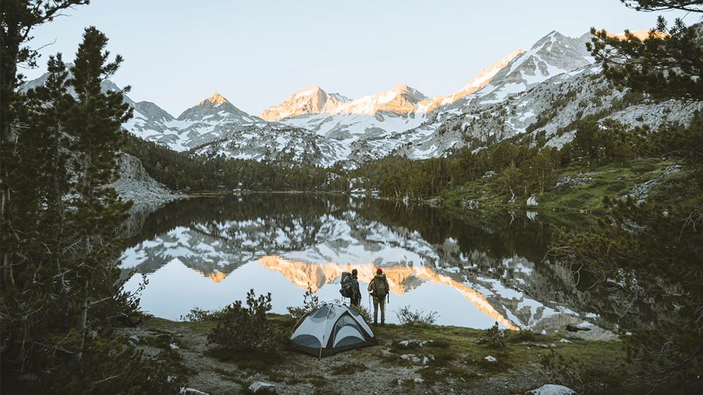 Tent-Set-up-By-Lakes-Surrounded-By-Mountains