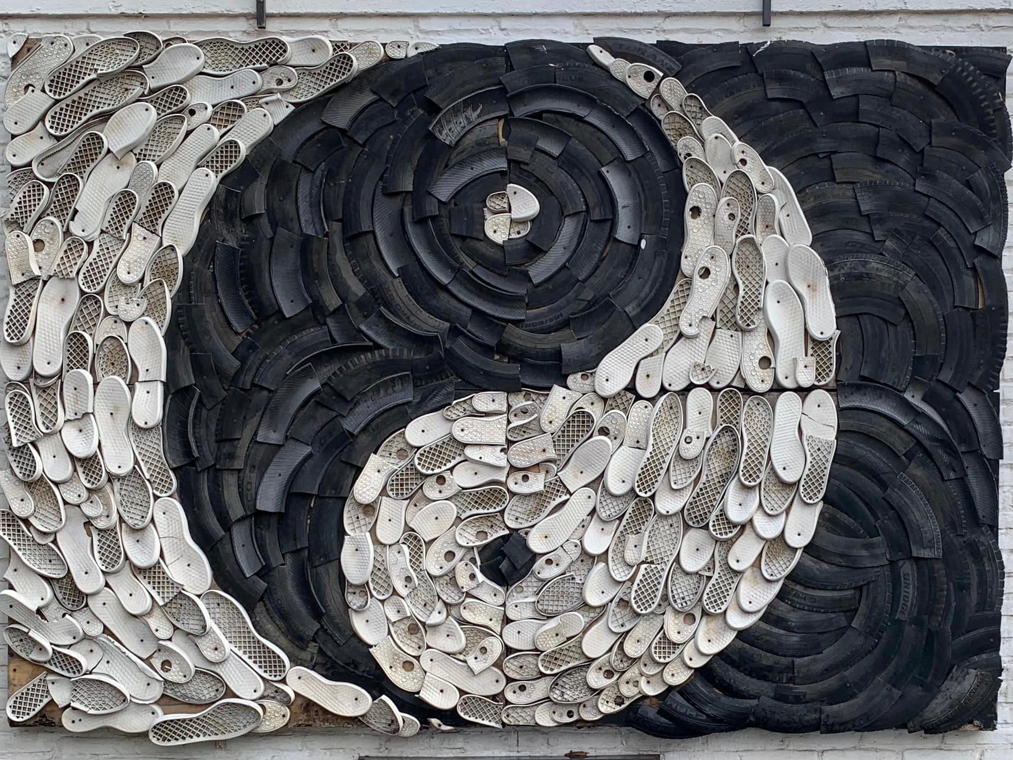 Yin Yang Art Installation using discarded flip flops and sandals in Bali