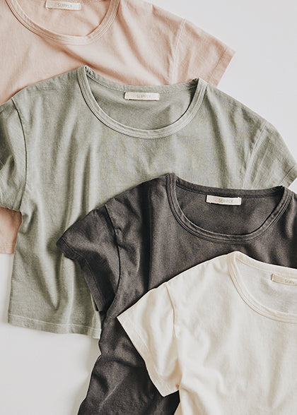 Girls Nattie Organic Tee available in ash pink, bone, sage mist, and washed grey.