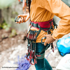 person is ready for climbing to the mounain and wearing the HARNESS