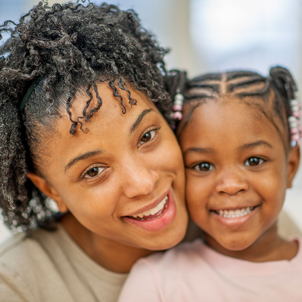 Mom with little girl with braids