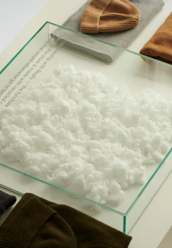 Pile of Organic cotton as exhibition on a counter at Organic Basics’ Copenhagen store.