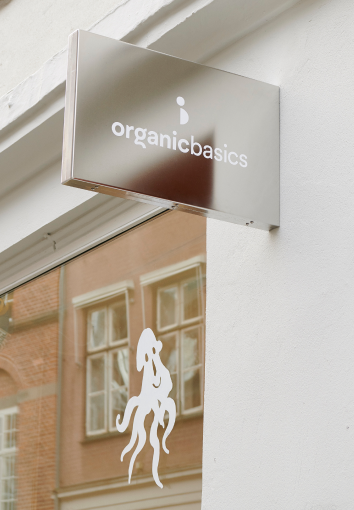 Pile of Organic cotton as exhibition on a counter at Organic Basics’ Copenhagen store.