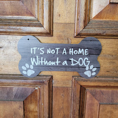 It is not a home without a dog  on wooden door