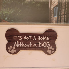 It is not a home without a dog  on white door