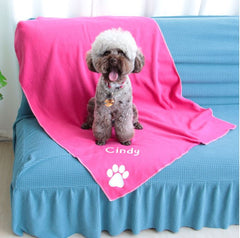 small dog on rose personalised dog blanket on a couch
