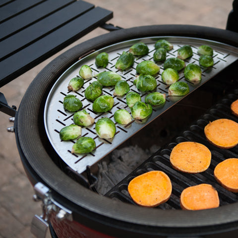 Use a stainless steel vegetable grate to cook brussels sprouts on low heat and a cast iron grate to cook sweet potato slices at higher temperature