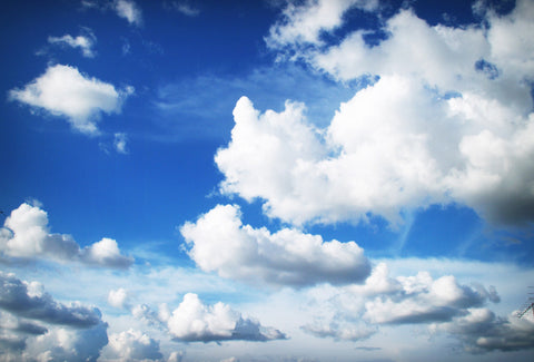 the image shows a blue sky with some clouds