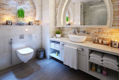 the image shows a very nice looking bathroom with an arched mirror.