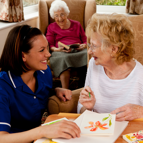 Carer with elderly ladies