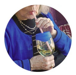 A woman drinking a glass of wine through a Safe Sip