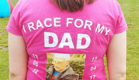 The back of one of Amanda's racing jerseys with the words – I race for my dad – as well as a picture of him