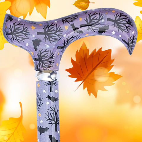 The head of the Bats walking stick. The background is autumnal leaves and colours
