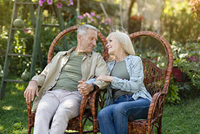 Couple in chairs in the garden