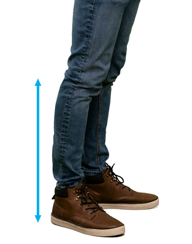 The lower half of a man (he is wearing jeans). There is an double-arrowed line that runs from behind his knees to his foot