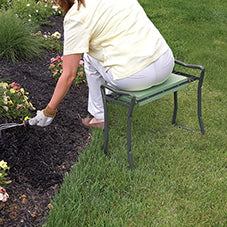 Lady tending flower patch using stool