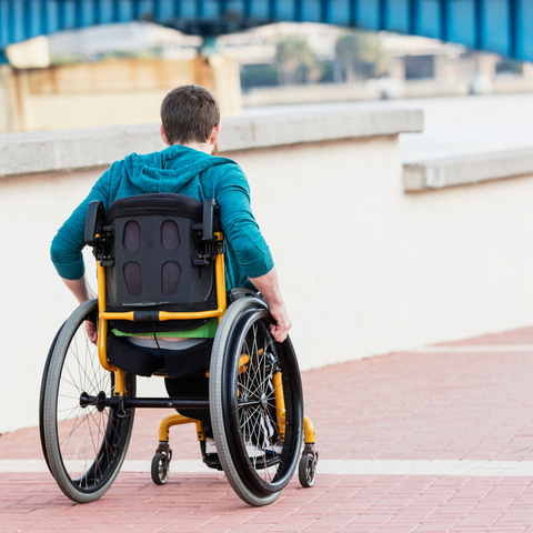 Man using self propelled wheelchair