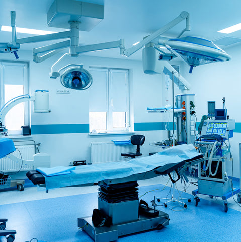 An operating theatre bathed in blue light