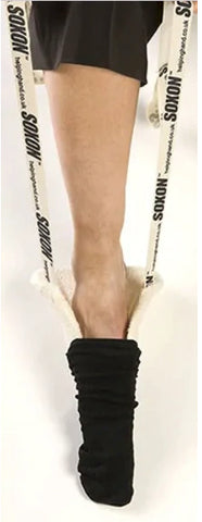 A person putting their foot into the Soxon Sock Aid